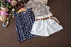 2018 Mädchen-Sommer-Outfits, ärmelloses T-Shirt mit Blumendruck + weiße Shorts, Hosen, 3-teiliges Set, Mädchen-Kleidungsset, Kinder-Outwear-Set mit Gürtel Boutique