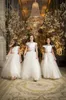 Elfenbein Jewel Neck Capped Sleeves Blumen Mädchen Kleider für Hochzeiten Spitze Sleeves Zipper zurück mit Bow Satin Kids Formal Wear Erstkommunion
