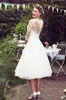 Vintage 50's Style Short Wedding Gown Half Sleeves Tulle Lace Applique Tea Length Bridal Wedding Gowns With Buttons Country