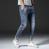 Hot selling day cultivation stretch leisure 9 points pants men break holes Haren feet nine points jeans