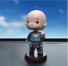 Car doll ornaments creative resin material cute cartoon spring shook his head small monk car interior decoration accessories