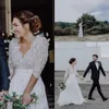 Robes de mariée à manches longues 2018 col en V illusion corsage en mousseline de soie, plus la taille robes de mariée sur mesure plage Boho robes de mariée