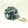 Bonito artesanal Camellia Hydrangea Flor Keychain Tassel Pu Chaveiro Chaveiro Carro Chaveiro Anel de Chaveiro Saco de Mulheres Charme Pingente