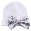 Forniture premaman Cappello per neonato Beanie Cappello in maglia con fiocco in paillettes carino Primavera Autunno Cotone 0-3 mesi