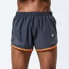 Esportes homens com shorts respiráveis ​​rápida seca preta cinza academia curta homme grande tamanho285n