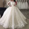 2019 Nuevo vestido de fiesta hinchado Vestidos de novia Fuera del hombro Ilusión Mangas completas Apliques de encaje Longitud del piso Organza Tallas grandes Vestido de novia formal