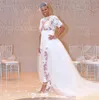 Bröllop jumpsuit strandklänningar med löstagbart tåg se genom spets bodice plus storlek nigerianska afrikanska brudklänningar