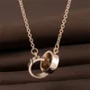 Collana da donna con ciondolo a doppio anello in oro rosa tutto abbinato Collana con ciondolo a forma di ciondolo con motivo a quattro foglie fortunato