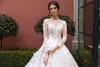 Cathedral Wedding Dresses 2019 Long Sleeves Illusion Neckline Ball Gown vestidos de noiva Covered Buttons Real Pictures robe de mariee