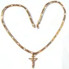 gold figaro chain with cross