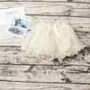 Baby tjejer kjolar prinsessa tutu kjolar dance party prestanda mini kjol söt båge pärla barn flicka kjol 5 färger för 2-7t barn kläder