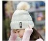 New fashion women's hats winter hat knit plus fluff ball warm letters leisure hat free shipping