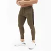 2019 Pantaloni da jogging fitness casual da uomo Pantaloni Palestre Pantaloni sportivi skinny da uomo in cotone elasticizzato Pantaloni da allenamento LOGO ricamati