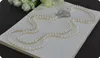 Vente chaude nouveau 2 rangées 7-8mm naturel blanc perle d'eau douce zircon accessoires papillon boucle fleur pendentif chandail collier bijoux de mode