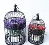 Porta gabbie per uccelli vintage bianco e nero europeo Moda Gabbia per uccelli in ferro cannella decorazione di nozze oggetti di scena decorazione decorativa 2524429