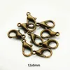 1000pcs 12mm Metal Hummer Clasps Hooks Guld / Rhodium Hummer Clasps Krokar för smycken Att hitta DIY Halsband