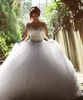 Vestidos de novia árabes de lujo 2020 Cristales con cuentas brillantes Vestidos de novia de manga larga Vestido de fiesta hinchado Vestidos de novia de tul Vestidos de novia atractivos