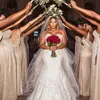 プラスサイズの長いウェディングドレスセクシーな南アフリカのビーズマーメイドブライダルドレスタルオーバースカートグラマラススパンコールアップリケ結婚式のガウン