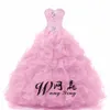 Peacock Sweetheart Crystal Ball Gown Sweet 16 Dress Custom Made Peach Puffy Organza Crystal Quinceanera Klänningar