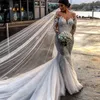 Chic Boho stilig sjöjungfru bröllopsklänningar Sheer Jewel Neck Långärmade Tulle Bridal Klänning Glamorös Lace Appliques Beach Bröllopsklänningar
