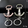 Ny populär mens fest Praktisk flasköppnare Keychain Guldpläterad nyckelring Ring för grossist