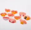 Hallowmas drôle dents jouets festival fête costume parodie dent accessoire dents de vampire en plastique poisson d'avril jour accolades accessoires en gros