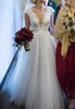 Tulle Ivory Beach Bröllopsklänningar Juvel Neck Lace Appliques Sheer Backless Bröllopsklänningar Billiga Skräddarsydda Golv Längd Bröllopsklänning