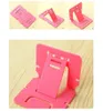 Candy Färg Telefonhållare Plast Folding Dual Mobiltelefon Universal Bracket för telefonkort Stativ Fabriks Partihandel