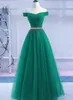 2019 Vestidos de baile modestos Vestido largo formal Tul verde Fuera del hombro Cristales Con cordones Núcleo Parte posterior del piso Vestidos de noche Vestido formal
