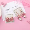 2018 Nieuwe Koreaanse versie van de roze boog hanger oorbellen vrouwelijke modellen strass hanger oorbellen mode-sieraden zoete cadeau detailhandel