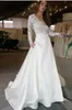 V neck moda vestidos de noiva longo com ilusão mangas compridas rendas ver através de saia superior com bolsos designer de uma linha de vestido de noiva 224