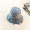 新しい夏洗浄デニムサンハット女性ファッションタッセルフロッピーキャップレディースワイドブリムビーチバケツ帽子コットン折りたたみ式簡潔
