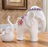 Flores de cerâmica branca elefante amantes estátua de decoração para casa artesanato decoração do quarto ornamento de casamento estatueta de porcelana animal do jardim