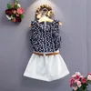 2018 Mädchen-Sommer-Outfits, ärmelloses T-Shirt mit Blumendruck + weiße Shorts, Hosen, 3-teiliges Set, Mädchen-Kleidungsset, Kinder-Outwear-Set mit Gürtel Boutique