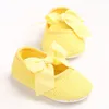 Fabrikpreis Hübsches Baby Mädchen Hohlspitze Großer Bogen Rutschfeste Lauflernschuhe Prinzessin Blume Elegante Kleinkindschuhe 7 Farben 0-1 Jahre alt