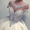 Projektant luksusowe kryształy z koralikami arabskie suknie balowe suknie ślubne Sheer Cap Rleeves Frezowanie cekiny Puffy długie suknie ślubne