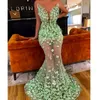 Voir à travers la robe de bal sirène avec des appliques florales 3D pure bijou cou sans manches tulle longueur de plancher robe de soirée robe de soirée de célébrité