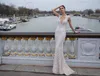 Syrenka Julie Vino Suknie ślubne 3D Kwiatowe aplikacje Koraliki Tassel Illusion Bodice Vestidos de Novia Deep V Sheer Neck Robe de Mariee