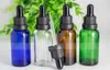 Botellas cuentagotas de vidrio de color verde azul claro ámbar de 30 ml Botella vacía de 30 ml con tapa de cabeza de plástico Botellas de embalaje de aromaterapia con gotas para los ojos de 1 oz