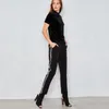 Sportliche, weiße, seitlich gestreifte Hose mit hoher Taille, Damen-Street-Chic-Preppy-Schwarz-Freizeithose, stilvolle, schmal zulaufende Trainingshose für Damen