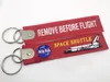 Navetta spaziale della NASA Rimuovi prima del tessuto di volo Catena per chiave Aviazione Tags anelli 1pc Halloween Cosplay Portachiavi Portachiavi Portachiavi Regalo pendente