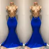 2018 Royal Blue Mermaid Prom Dresses Gold Lace Aplikacje Wysokiej szyi Długie Suknie Prom Seksowna Bez Rękawów Formalna Dress Vestido De Festa