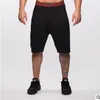 pantaloncini da palestra da uomo di nuova tendenza casual abbigliamento da uomo sciolto pantaloncini da fitness da uomo estivi di alta qualità al ginocchio