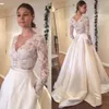 Vestidos de novia de manga larga de encaje Elegante Una línea Botón cubierto Vestidos de novia vintage Baratos 2018 Vestidos de novia de talla grande con cuello en V de playa