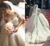 2018 Ball Gown Abiti da sposa Arabo Bling Off spalla Maniche corte Illusion Tulle Perline Strass di cristallo Cattedrale Treno Abiti da sposa
