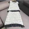 New design women's autumn european fashion o-neck sleeveless knitted tassel crop top vest and pencil short skirt twinset dress suit