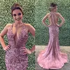 Luxrious Rhinestone Mermaid Prom Dress Diepe V-hals Pailletten Krème Crystal Cutaway Partyjurken Sexy Mode Avondjurk Dubai Jurken