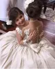 Ballkleid-Blumenmädchenkleider aus elfenbeinfarbener Spitze für Hochzeit, Party, Kleinkind-Mädchen-Festzug-Kleider, Kinder-Kommunion-Abschlussball-Kleider, lange Ärmel, transparenter Rücken