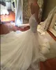 Vestidos de sirena Corias de espagueti sexy Apliques de encaje de tul Tiros Vestidos de boda en tren de la corte Vestido de novia