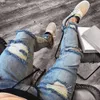 Jeans da uomo con cerniera skinny con buco da motociclista strappati alla moda 2018 Nuovi pantaloni lunghi in denim slim fit sfilacciati distrutti